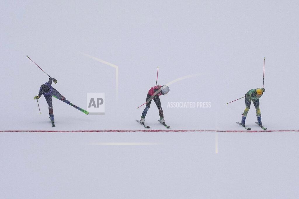 Gregory Bull Germany's Daniela Maier, right, crosses the finish line a head of Switzerland's Fanny Smith and Canada's Brittany Phelan, left, during the women's cross semifinal at the 2022 Winter Olympics, Thursday, Feb. 17, 2022, in Zhangjiakou, China. (AP Photo/Gregory Bull)