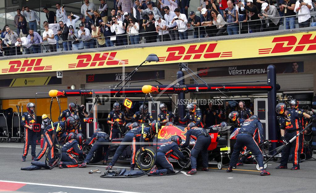 Marco Ugarte Pit crew change tires of the car of Red Bull driver Max Verstappen, of the Netherlands, during the Formula One Mexico Grand Prix auto race at the Hermanos Rodriguez racetrack in Mexico City, Sunday, Oct. 27, 2019. (AP Photo/Marco Ugarte)
