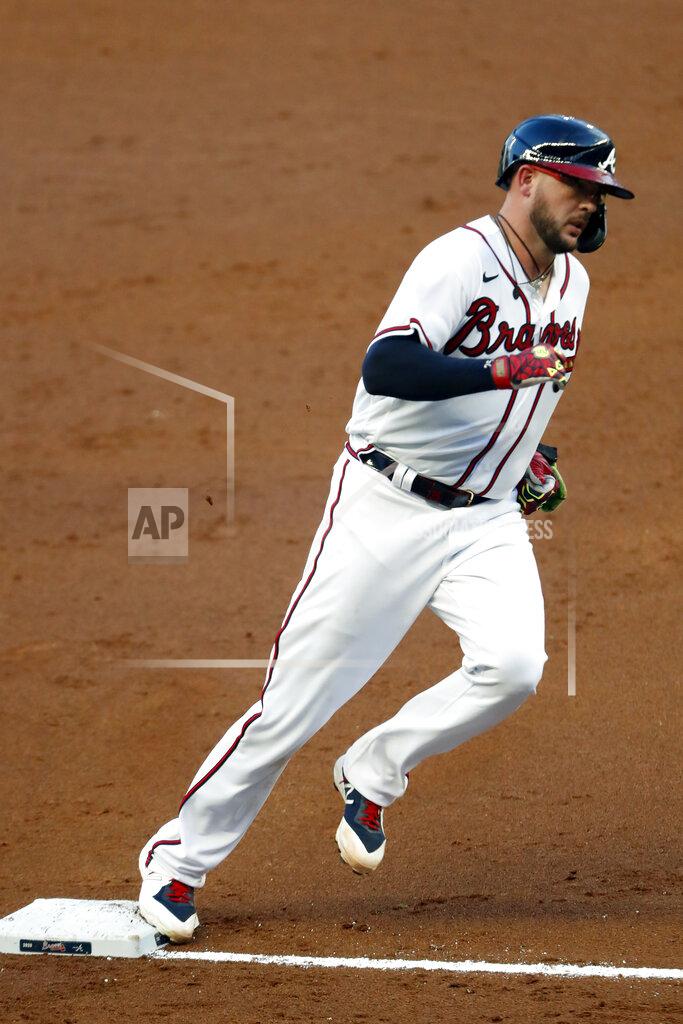 John Bazemore Atlanta Braves' Tyler Flowers rounds third base after hitting a home run in the second inning of a baseball game against the Toronto Blue Jays Tuesday, Aug. 4, 2020, in Atlanta. (AP Photo/John Bazemore)
