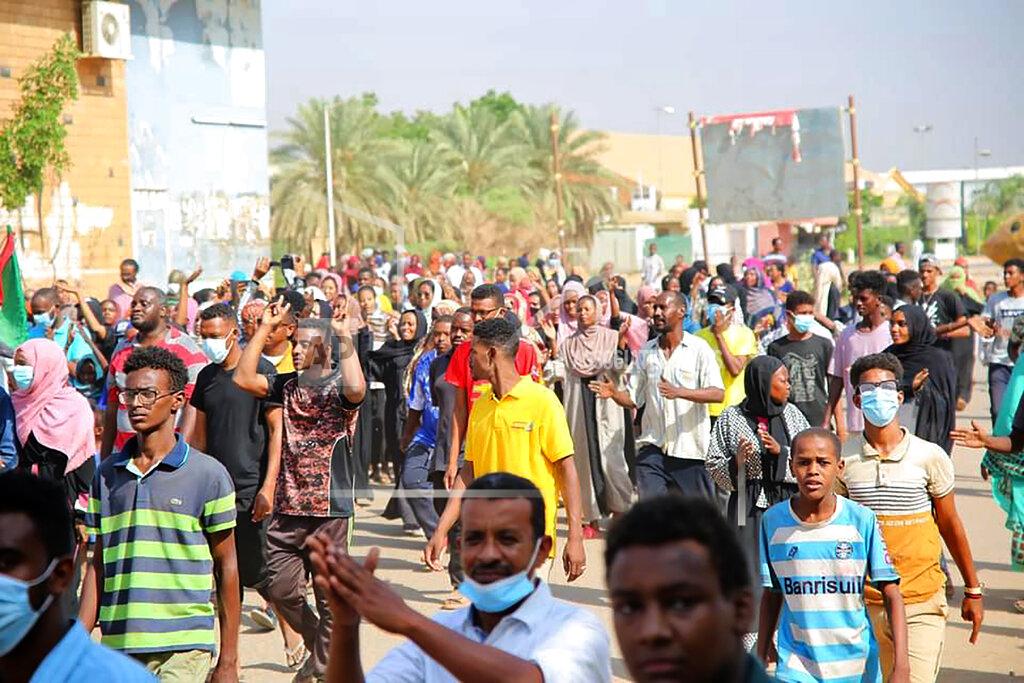 Ashraf Idris Thousands of pro-democracy protesters take to the streets to condemn a takeover by military officials in Khartoum, Sudan, Monday Oct. 25, 2021. Sudan’s military seized power Monday, dissolving the transitional government hours after troops arrested the acting prime minister and other officials. The takeover comes more than two years after protesters forced the ouster of longtime autocrat Omar al-Bashir and just weeks before the military was expected to hand the leadership of the council that runs the African country over to civilians. (AP Photo/Ashraf Idris)