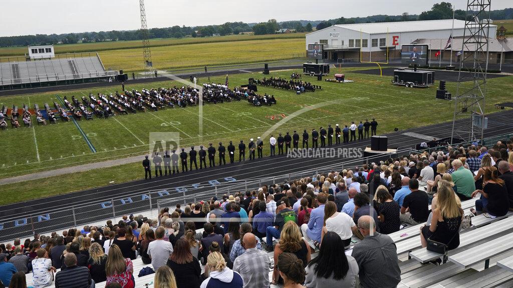 Tony Dejak Mourners gather for the funeral of Navy Corpsman Maxton Soviak at Edison High School Stadium, Monday, Sept. 13, 2021, in Milan, Ohio. Soviak was one of 13 U.S. troops killed in a suicide bombing at Afghanistan's Kabul airport on Aug. 26. (AP Photo/Tony Dejak)