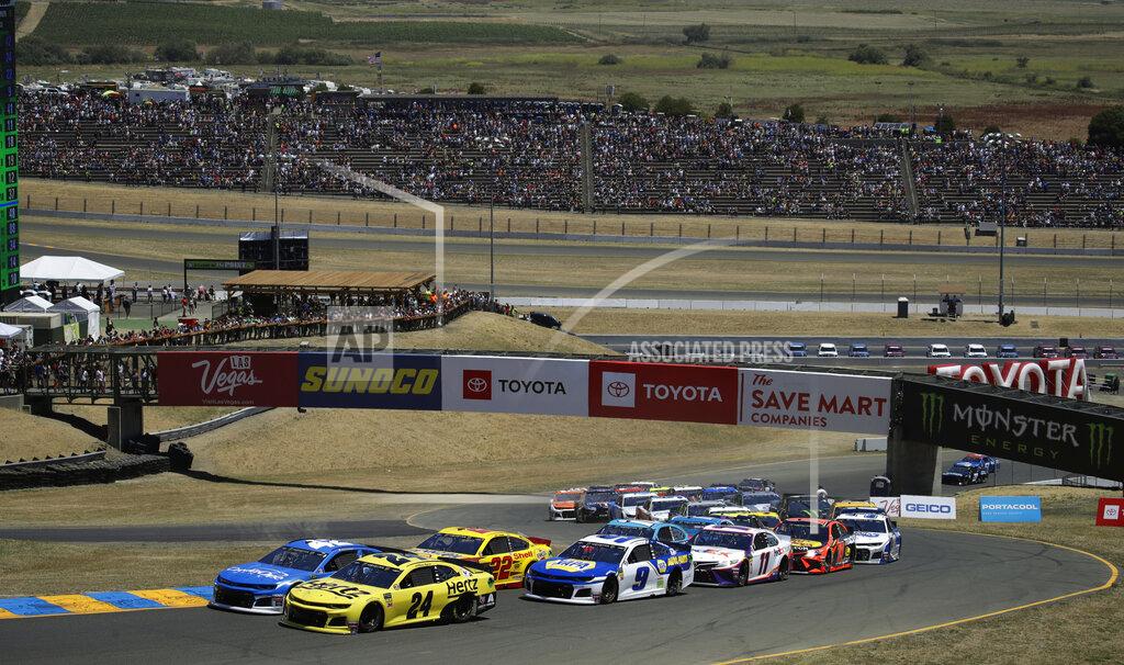 Ben Margot William Byron (24) leads the pack at the start of a NASCAR Sprint Cup Series auto race Sunday, June 23, 2019, in Sonoma, Calif. (AP Photo/Ben Margot)