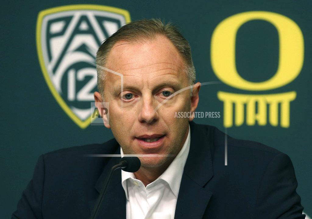 FILE - In this Nov. 29, 2016, file photo, Oregon athletic director Rob Mullens talks to the media in Eugene, Ore., after the firing NCAA college football head coach Mark Helfrich. There are a lot of new voices taking part in the College Football Playoffs selection process. Nearly half of the 13 committee members are serving for the first time. There are six new members taking part in the process to determine the first ranking for this season. It is the biggest turnover since the original group in 2013. The first 2018 ranking comes out Tuesday night, Oct. 30, 2018. “Every committee, every group, and every year in unique too, so even if you have the same members, it would be unique because it’s a different data set and a different year,” said Mullens, the fourth-year committee member and new chairman. (Chris Pietsch /The Register-Guard via AP, File)
