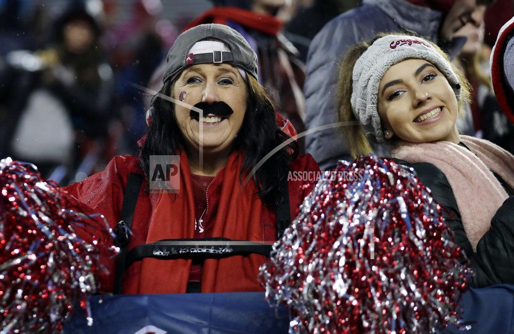 Ted S. Warren A Washington State fan wears a mustache in tribute to quarterback Gardner Minshew before an NCAA college football game against Washington, Friday, Nov. 23, 2018, in Pullman, Wash. (AP Photo/Ted S. Warren)
