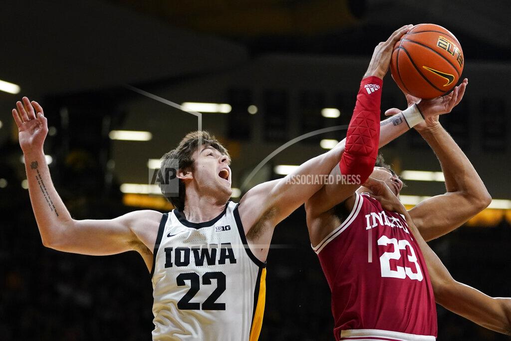 Charlie Neibergall Iowa forward Patrick McCaffery (22) fights for a rebound with Indiana forward Trayce Jackson-Davis (23) during the first half of an NCAA college basketball game, Thursday, Jan. 13, 2022, in Iowa City, Iowa. (AP Photo/Charlie Neibergall)
