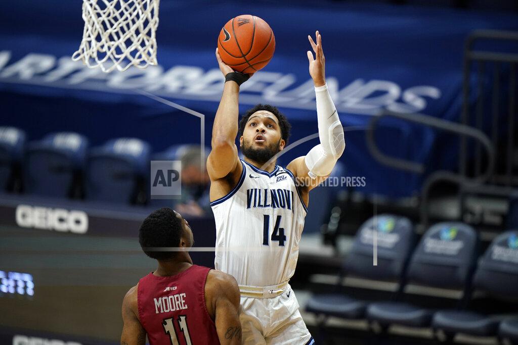 Matt Slocum Villanova's Caleb Daniels (14) goes up for a shot against Saint Joseph's Rahmir Moore (11) during the first half of an NCAA college basketball game, Saturday, Dec. 19, 2020, in Villanova, Pa. (AP Photo/Matt Slocum)