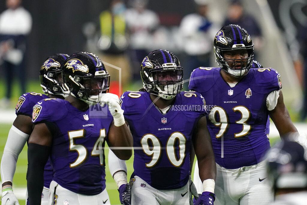 Matt Patterson Baltimore Ravens defenders Pernell McPhee (90) Calais Campbell (93) prepare for the next play during an NFL football game against the Houston Texans, Sunday, Sept. 20, 2020, in Houston. In the midst of an NFL season that is course to set records for the most points and touchdowns, the Baltimore Ravens and Pittsburgh Steelers are winning on the strength of their defense. (AP Photo/Matt Patterson)