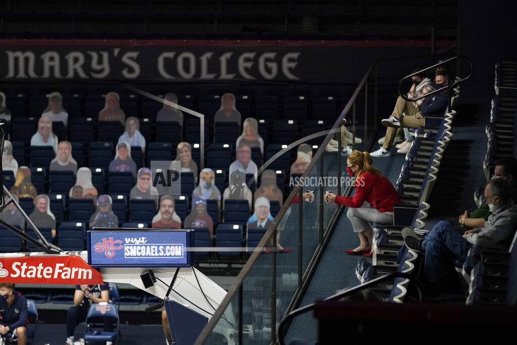 Jeff Chiu Fans sit socially distanced at right, as cutouts are in seats at left during the second half of an NCAA college basketball game between Saint Mary's and Gonzaga in Moraga, Calif., Saturday, Jan. 16, 2021. (AP Photo/Jeff Chiu)