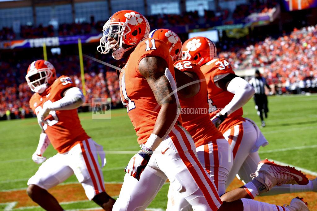 Richard Shiro Clemson's Isaiah Simmons (11) celebrates after returning an interception for a touchdown during the first half of an NCAA college football game against Louisville, Saturday, Nov. 3, 2018, in Clemson, S.C. (AP Photo/Richard Shiro)