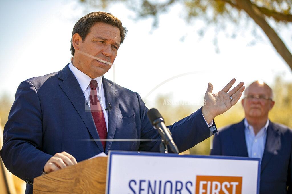 Alan Youngblood FILE - In this March 5, 2021 file photo, Florida Gov. Ron DeSantis speaks to the media as he visited the drive-thru COVID-19 vaccination site at On Top of the World in Ocala, Fla., Repealing statewide mask mandates and criticizing the Biden administration’s unemployment-based formula for distributing billions in federal aid has put Republican governors and their approach to handling the coronavirus pandemic back in the spotlight. (Alan Youngblood/Ocala Star-Banner via AP)