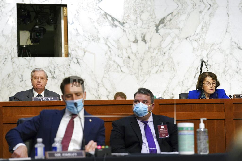 Erin Schaff Sen. Lindsey Graham, R-S.C., left, and Sen. Dianne Feinstein, D-Calif., listen during a confirmation hearing for Supreme Court nominee Amy Coney Barrett before the Senate Judiciary Committee, Monday, Oct. 12, 2020, on Capitol Hill in Washington. (Erin Schaff/The New York Times via AP, Pool)