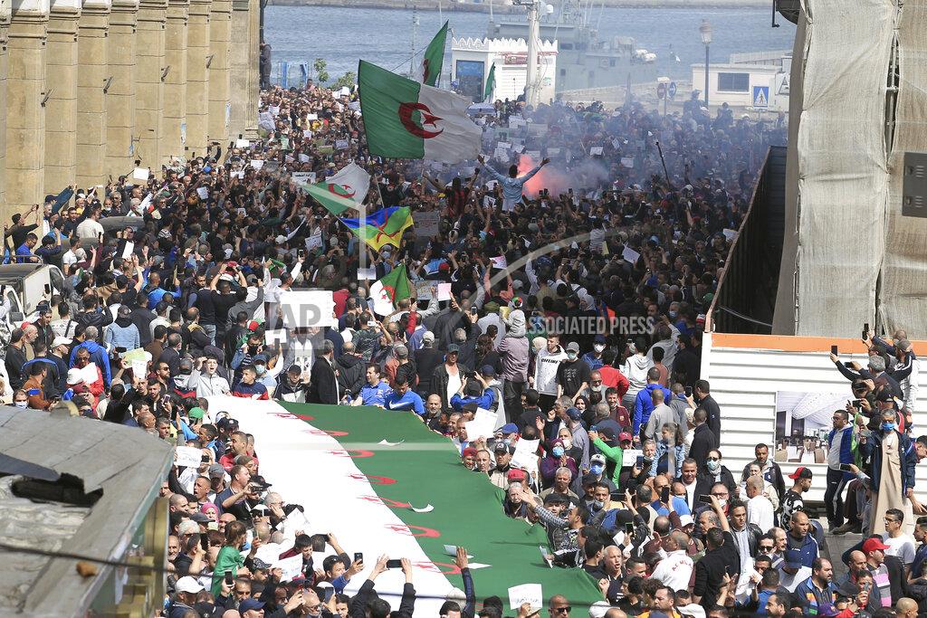 Fateh Guidoum FILE - In this April 2, 2021 file photo, demonstrators invade the streets of Algiers. A crackdown on the pro-democracy Hirak movement, with hundreds arrested around Algeria during last week's 117th Friday march, casts a pall over presidential efforts to give a new face to a nation whose army plays a backseat role in governance. (AP Photo/ Fateh Guidoum, File)