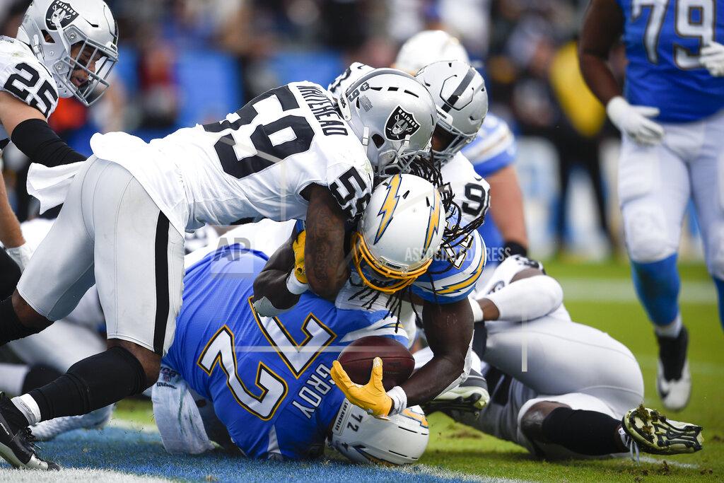Kelvin Kuo Los Angeles Chargers running back Melvin Gordon scores against the Oakland Raiders during the second half of an NFL football game Sunday, Dec. 22, 2019, in Carson, Calif. (AP Photo/Kelvin Kuo)