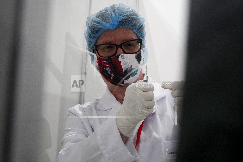 Boris Grdanoski A nurse prepares a COVID-19 vaccine, at the center for mass vaccination against COVID-19, at A1 Arena in Skopje, North Macedonia, on Tuesday, May 4, 2021. The European Union started delivering EU-funded coronavirus vaccines Tuesday to the Balkans, a region that wants to join the 27-nation bloc but where China and Russia have already been supplying the much-needed shots and making political gains. (AP Photo/Boris Grdanoski)