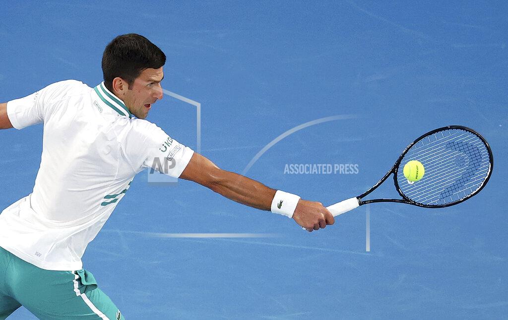 Hamish Blair Serbia's Novak Djokovic hits a backhand to Russia's Daniil Medvedev during the men's singles final at the Australian Open tennis championship in Melbourne, Australia, Sunday, Feb. 21, 2021. (AP Photo/Hamish Blair)