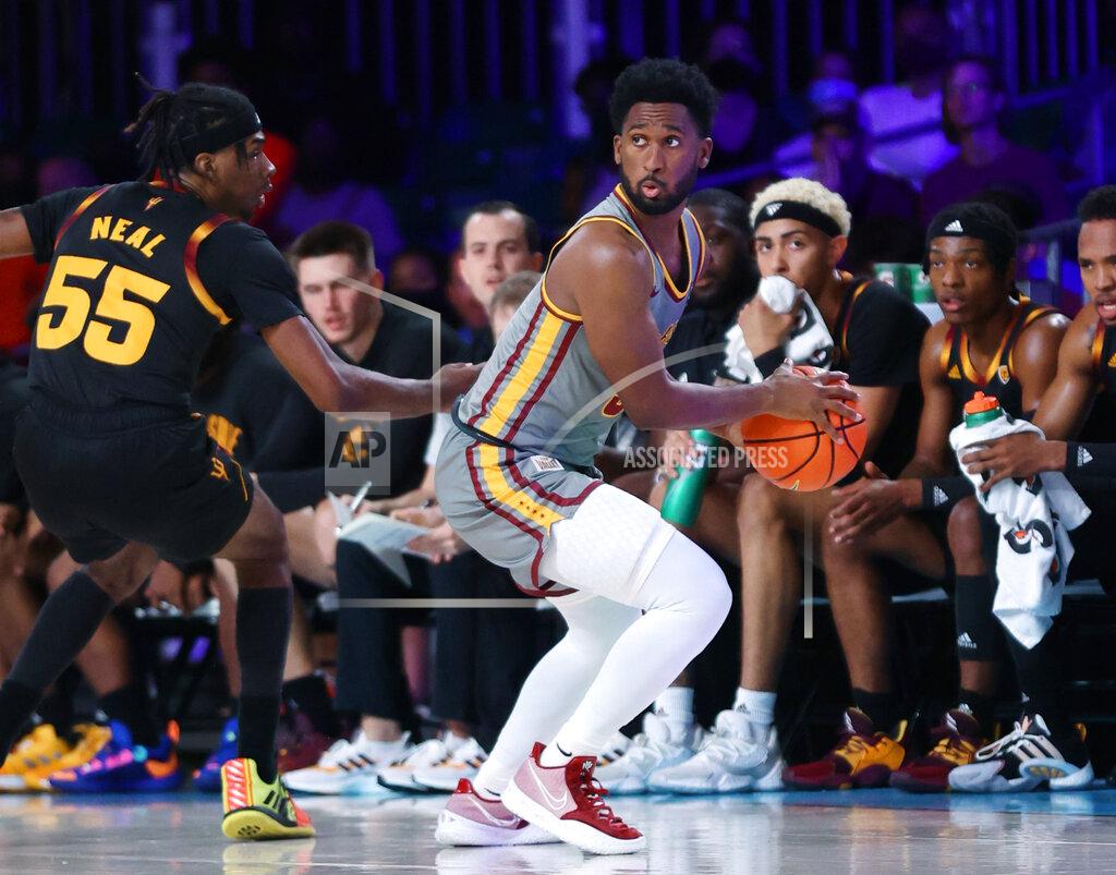 Tim Aylen In a photo provided by Bahamas Visual Services, Loyola Chicago guard Keith Clemons is defended by Arizona State's Jamiya Neal during an NCAA college basketball game at Paradise Island, Bahamas, Friday, Nov. 26, 2021. (Tim Aylen/Bahamas Visual Services via AP)
