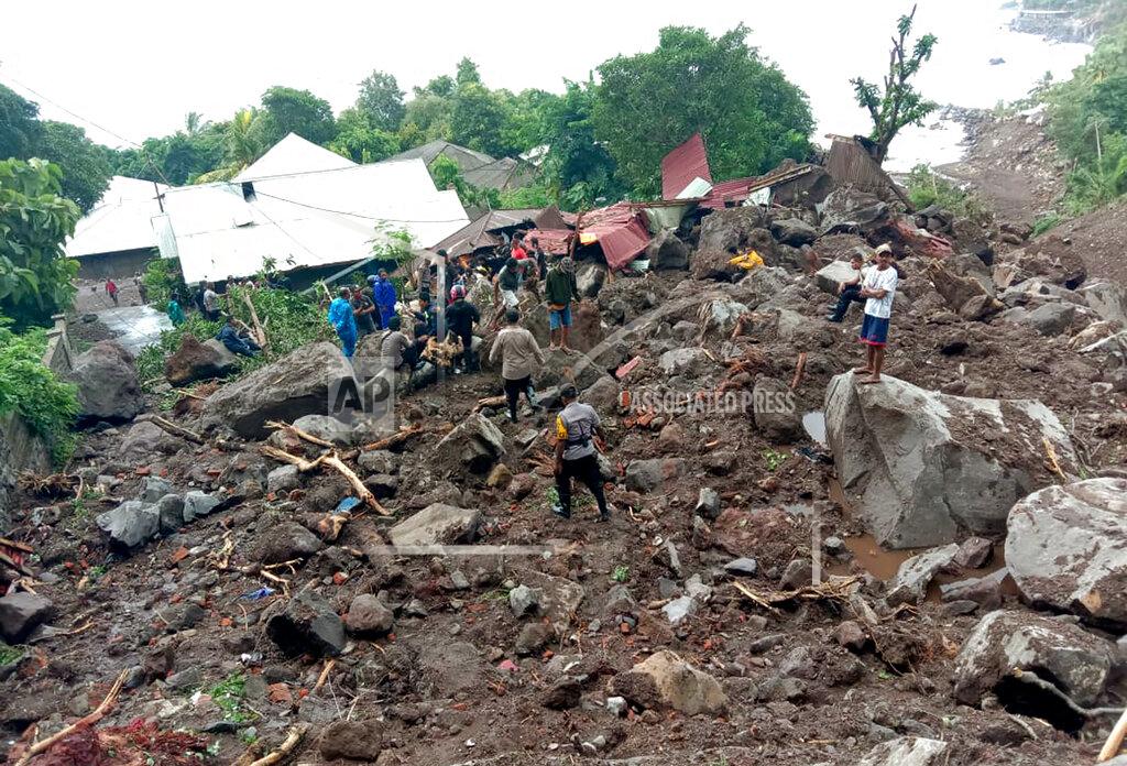 Ricko Wawo Rescuers search for victims at a village hit by a landslide in Ile Ape Timur on Lembata Island, East Nusa Tenggara province, Indonesia, Monday, April 5, 2021. Multiple disasters caused by torrential rains in eastern Indonesia and neighboring East Timor have left a number of people dead or missing as rescuers were hampered by damaged bridges and roads and a lack of heavy equipment Monday. (AP Photo/Ricko Wawo)