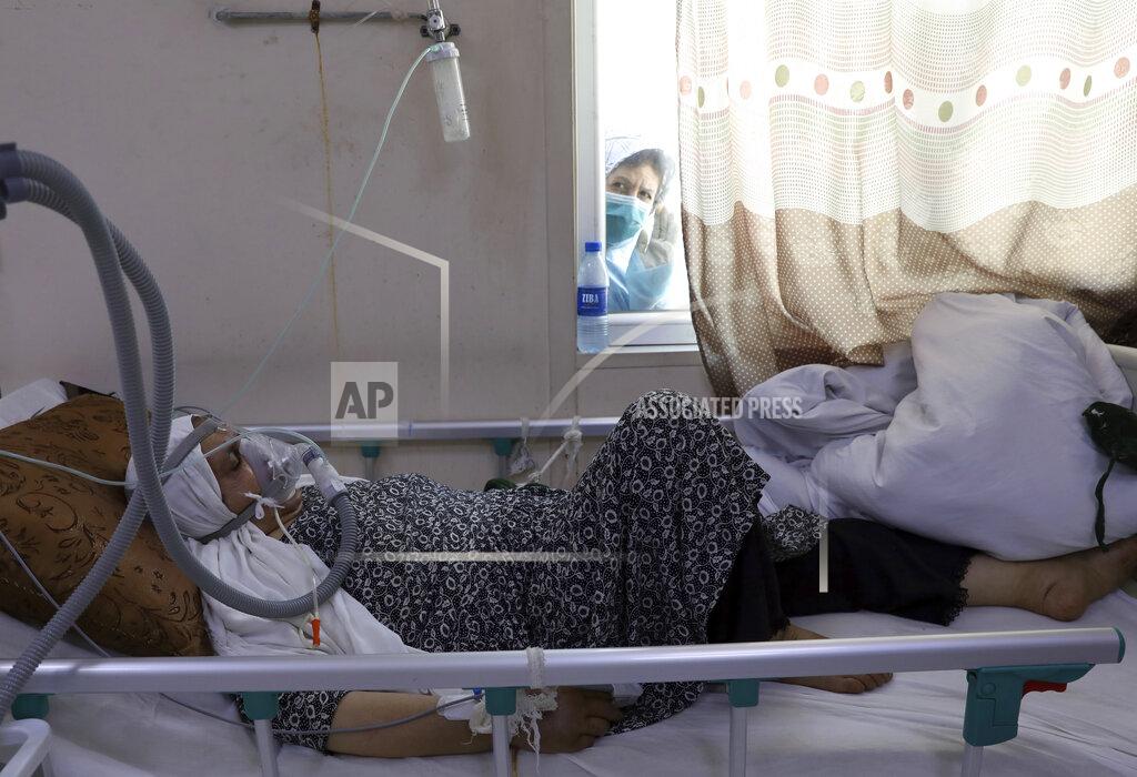 Rahmat Gul A patient is connected to oxygen tank in the intensive care unit ward for COVID-19 patients at the Afghan-Japan Communicable Disease Hospital in Kabul, Afghanistan, Sunday, May 30, 2021. Afghanistan is battling a brutal third wave of COVID infections, while health officials plead for vaccines, expressing deep frustration at the inequities of the global vaccine distribution. Positive COVID cases jump from eight percent to 60 per cent in some parts of the country. (AP Photo/Rahmat Gul)