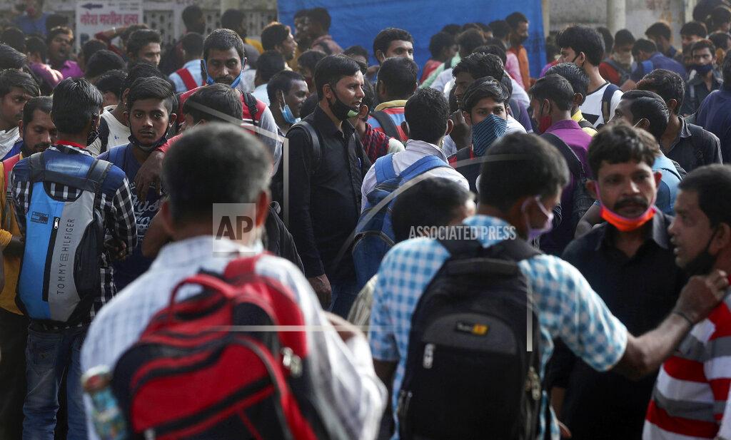 Rafiq Maqbool Migrant workers from other states wait for work in Mumbai, Maharashtra state, India, Monday, Nov. 23, 2020. India has more than 9 million cases of coronavirus, second behind the United States. (AP Photo/Rafiq Maqbool)