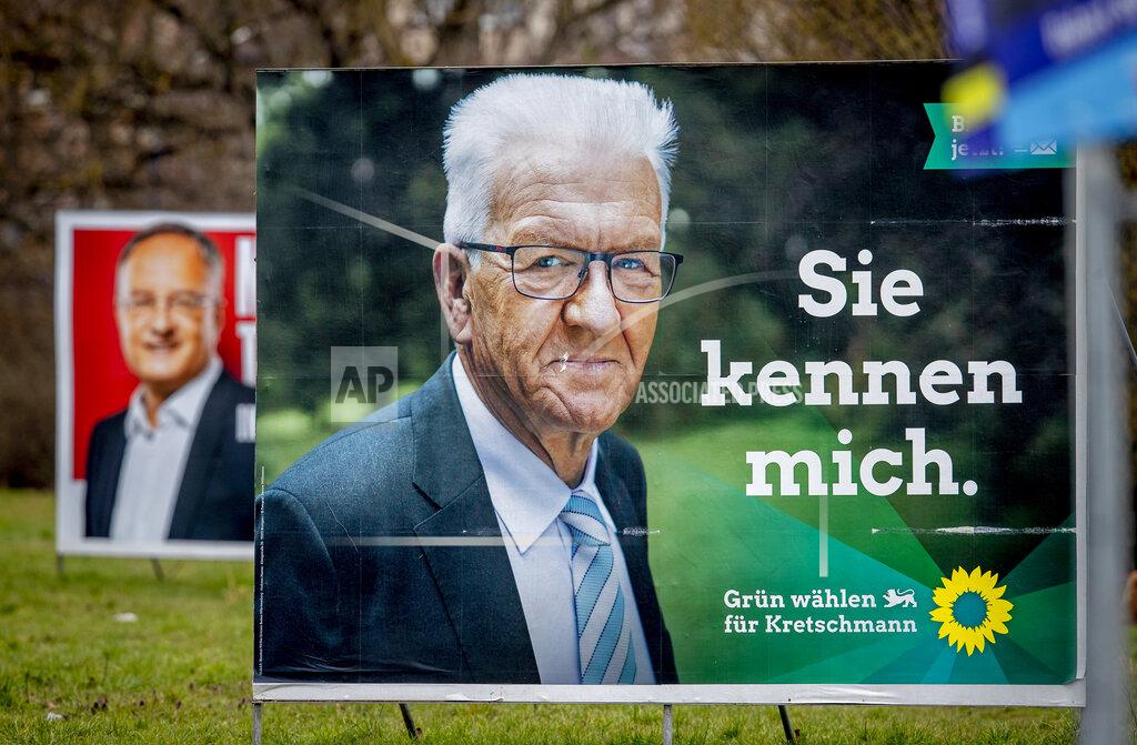 Michael Probst Election posters show Winfried Kretschmann from the Greens and the party's top candidate for the Baden-Wurttemberg federal state elections in Mannheim, Germany, Wednesday, March 10, 2021. The elections will take place next Sunday. Letters on left poster read "edges stabilize", letters on right poster read "you know me". (AP Photo/Michael Probst)