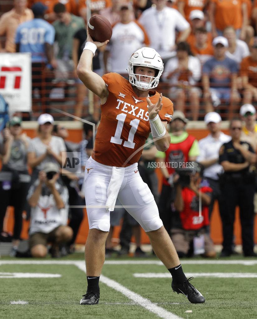 Eric Gay FILE - In this Saturday, Oct. 13, 2018, file photo, Texas quarterback Sam Ehlinger (11) throws against Baylor during the first half of an NCAA college football game in Austin, Texas. After years of being a late-season afterthought, Texas coach Tom Herman wanted the Longhorns to be competing for a Big 12 title in November. Texas is right where he wanted, with a key matchup against West Virginia to see just how long they stay there. (AP Photo/Eric Gay, File)
