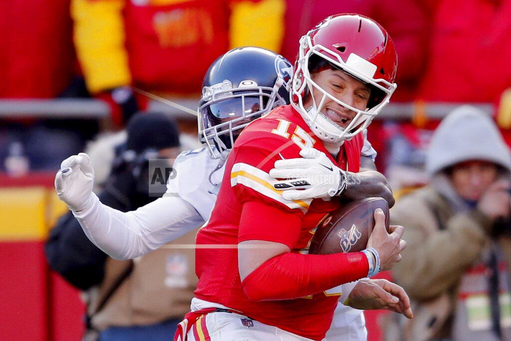 Jeff Roberson Kansas City Chiefs' Patrick Mahomes (15) runs for a touchdown against Tennessee Titans defensive tackle DaQuan Jones, rear, during the first half of the NFL AFC Championship football game Sunday, Jan. 19, 2020, in Kansas City, MO. (AP Photo/Jeff Roberson)