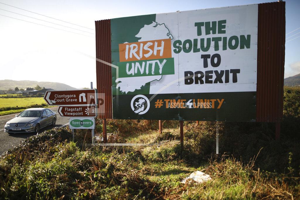 Peter Morrison FILE - In this Wednesday Oct. 16, 2019 file photo motorists pass along the old Belfast to Dublin road close to the Irish border in Newry, Northern Ireland. The chaotic scenes during a week of violence on the streets of Northern Ireland have stirred memories of decades of Catholic-Protestant conflict, known as "The Troubles." A 1998 peace deal ended large-scale violence but did not resolve Northern Ireland's deep-rooted tensions. (Photo/Peter Morrison, File)
