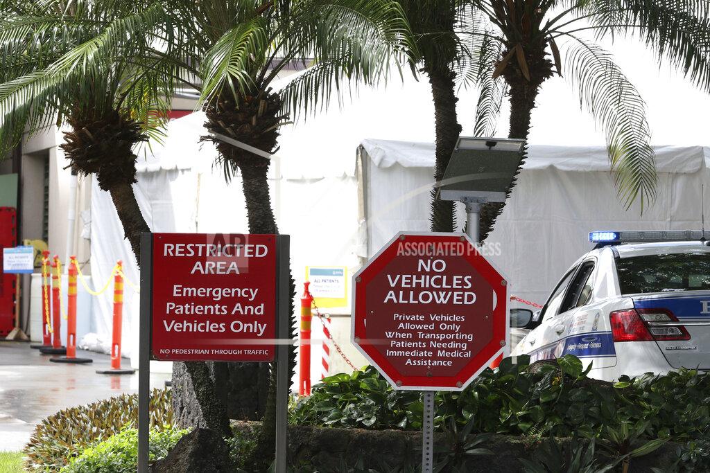 Caleb Jones FILE - In this Aug. 24, 2021, file photo a tent is seen outside the emergency room at The Queen's Medical Center in Honolulu. Health care workers in Hawaii say a lack of government action is worsening an already crippling surge of coronavirus cases in the islands, and without effective policy changes the state's limited hospitals could face a grim crisis. (AP Photo/Caleb Jones, File)