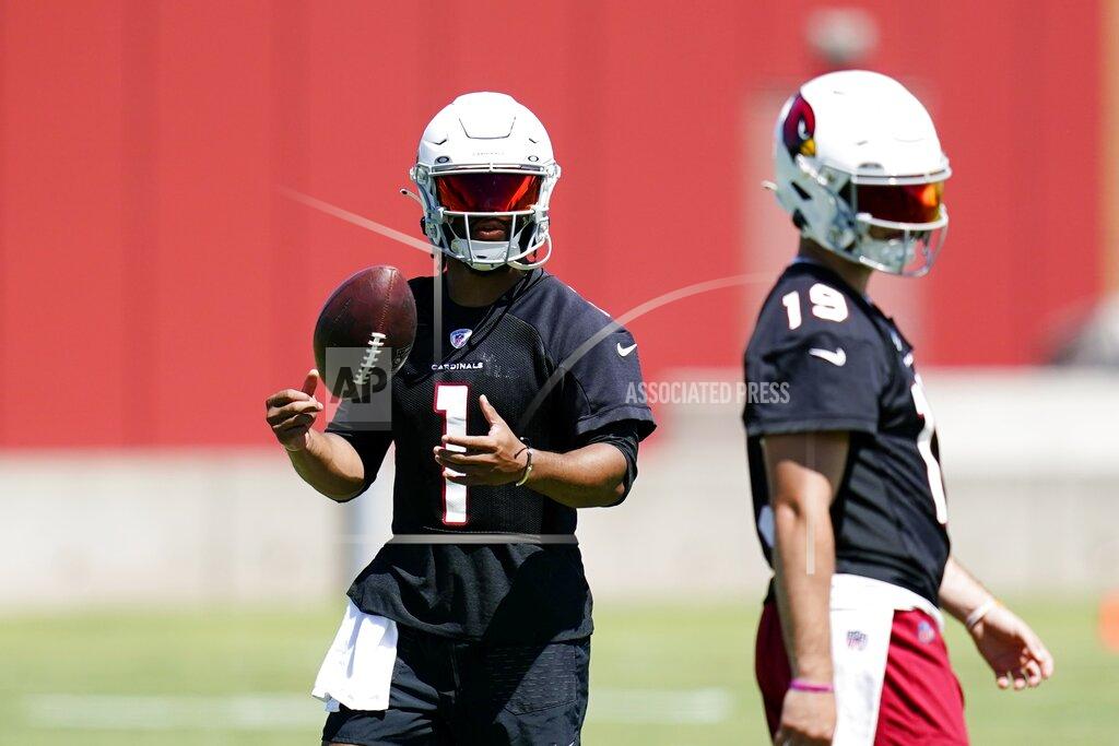 Ross D. Franklin Arizona Cardinals quarterback Kyler Murray (1) flips the ball in the air as Cardinals quarterback Trace McSorley (19) walks past at the NFL football team's practice facility Tuesday, June 14, 2022, in Tempe, Ariz. (AP Photo/Ross D. Franklin)