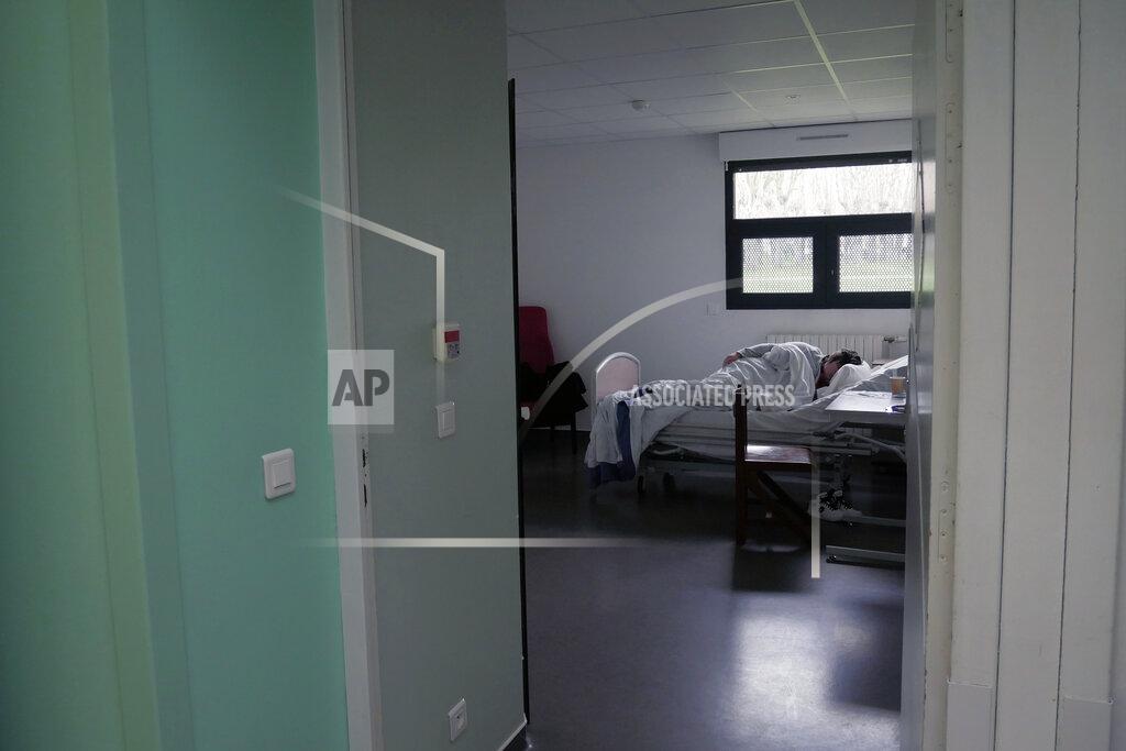 Thibault Camus A patient sleeps in his room in the emergency ward of the Rouvray psychiatric hospital, in Rouen, western France, Wednesday, Nov. 25, 2020. Lockdowns that France has used to fight the coronavirus have come at considerable cost to mental health. Surveying points to a surge of depression most acute among people without work, in financial hardship and young adults. (AP Photo/Thibault Camus)