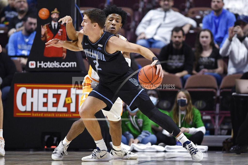 Jessica Hill Villanova's Collin Gillespie (2) drives to the basket as Tennessee's Kennedy Chandler (1) defends in the first half of an NCAA college basketball game, Saturday, Nov. 20, 2021, in Uncasville, Conn. (AP Photo/Jessica Hill)