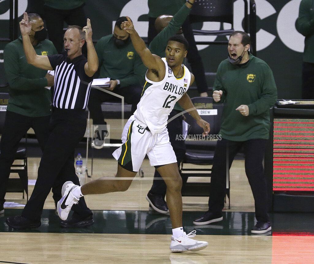 Jerry Larson Baylor guard Jared Butler (12) reacts after score a three point shot against Oklahoma State in the second half of an NCAA college basketball game, Thursday, March 4, 2021, in Waco, Texas. (AP Photo/Jerry Larson)