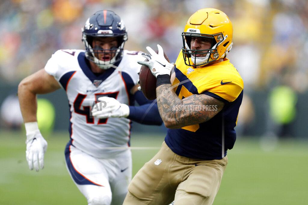Matt Ludtke Green Bay Packers fullback Danny Vitale, right, catches a 27-yard pass as Denver Broncos inside linebacker Josey Jewell chases during the second half of an NFL football game Sunday, Sept. 22, 2019, in Green Bay, Wis. (AP Photo/Matt Ludtke)