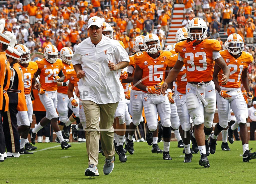 Wade Payne FILE - In this Sept. 15, 2018, file photo, Tennessee head coach Jeremy Pruitt leads his team as they run through the Power T before an NCAA college football game against UTEP in Knoxville, Tenn. The SEC West often brings out the worst in Tennessee. The Volunteers have lost 15 straight interdivisional games and haven’t beaten an SEC West team since 2010. (AP Photo/Wade Payne, File)