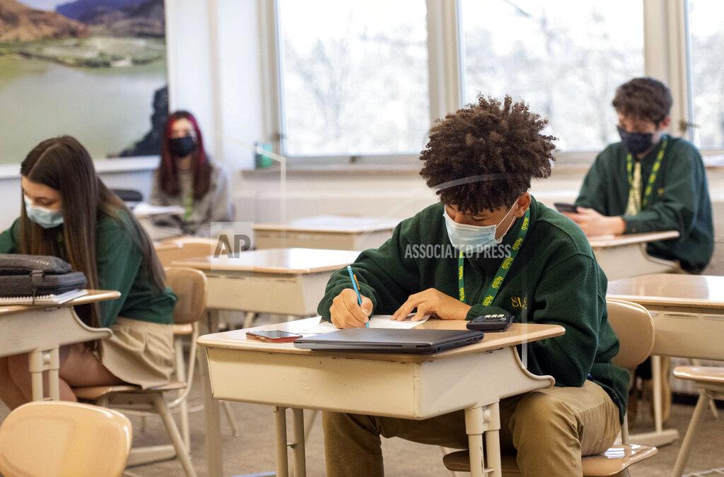 Emily Matthews Freshman Nicholas Brown takes a pre-geometry pop quiz with his classmates at Seton LaSalle Catholic High School, Wednesday, March 3, 2021, in the Mt. Lebanon suburb of Pittsburgh. (Emily Matthews/Pittsburgh Post-Gazette via AP)