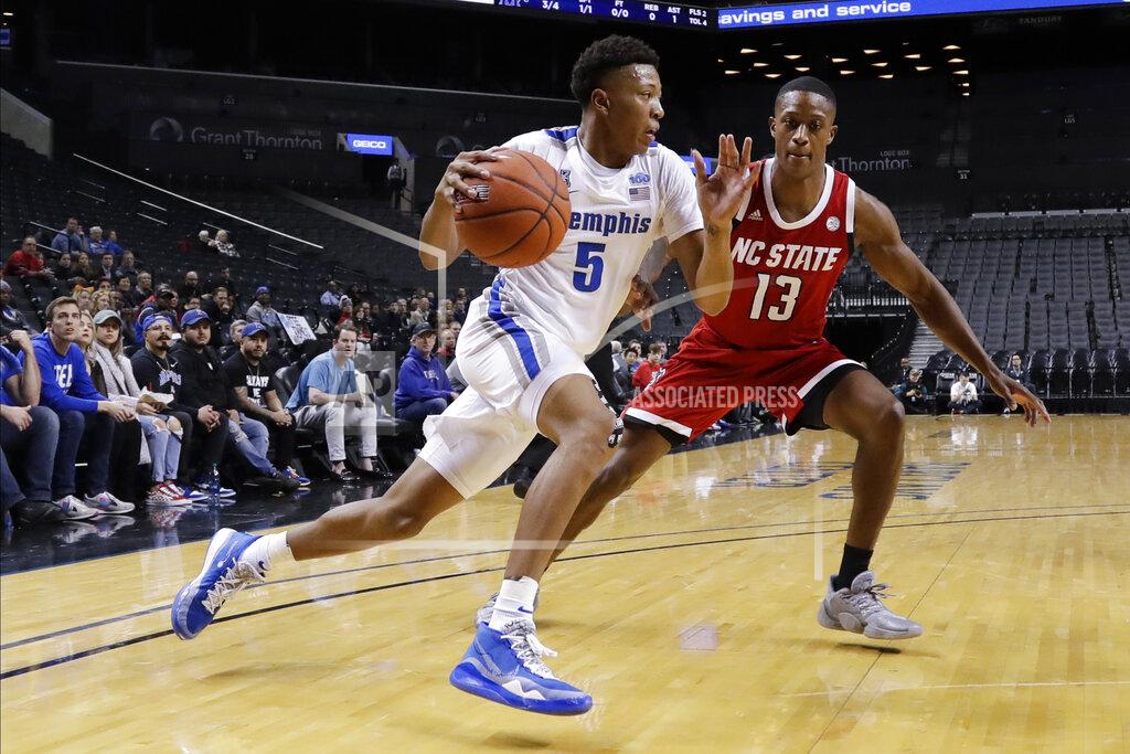 Frank Franklin Ii Memphis' Boogie Ellis (5) drives past North Carolina State's C.J. Bryce (13) during the first half of an NCAA college basketball game in the Barclays Classic, Thursday, Nov. 28, 2019, in New York. (AP Photo/Frank Franklin II)