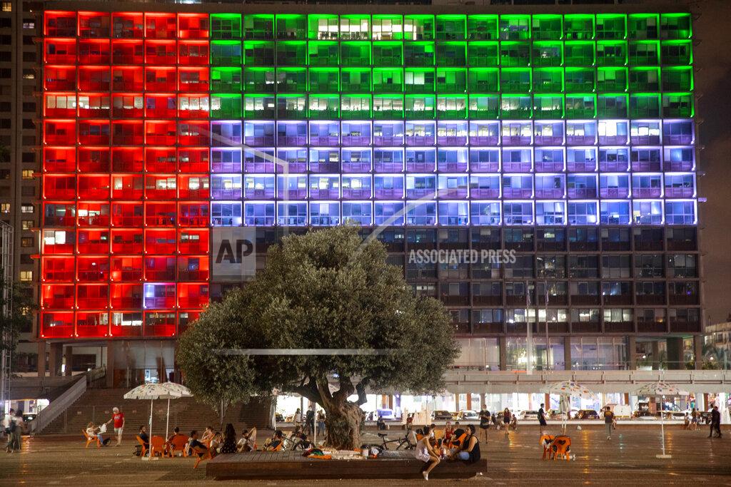 Oded Balilty Tel Aviv City Hall is lit up with the flags of the United Arab Emirates and Israel as the countries announced they would be establishing full diplomatic ties, in Tel Aviv, Israel, Thursday, Aug. 13, 2020. In a nationally broadcast statement, Prime Minister Benjamin Netanyahu said the "full and official peace" with the UAE would lead to cooperation in many spheres between the countries and a "wonderful future" for citizens of both countries. (AP Photo/Oded Balilty)