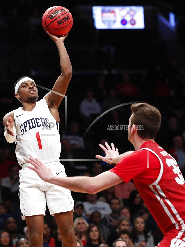 Kathy Willens Richmond guard Blake Francis (1) shoots as Wisconsin forward Nate Reuvers (35) defends during the second half of an NCAA college basketball game in the Legends Classic, Monday, Nov. 25, 2019, in New York. Richmond defeated Wisconsin 62-52. (AP Photo/Kathy Willens)