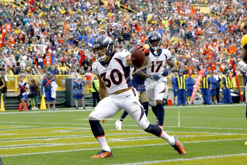 Mike Roemer Denver Broncos running back Phillip Lindsay celebrates after scoring during the first half of an NFL football game against the Green Bay Packers Sunday, Sept. 22, 2019, in Green Bay, Wis. (AP Photo/Mike Roemer)