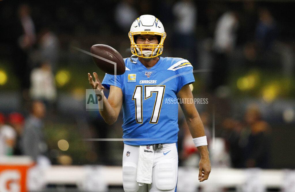 Rebecca Blackwell FILE - In this Nov. 18, 2019, file photo, Los Angeles Chargers quarterback Philip Rivers warms up before an NFL football game against the Kansas City Chiefs in Mexico City. Rivers is coming off one of the poorest seasons in his NFL career. The longtime quarterback for the San Diego and Los Angeles Chargers is now with the Colts after signing a one-year, $25 million contract. (AP Photo/Rebecca Blackwell, File)