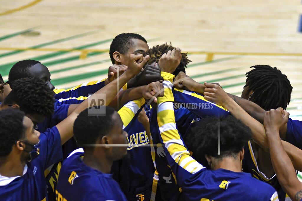 Gaston De Cardenas Carver College players huddle before their game against Florida International Monday, Dec. 21, 2020, in Miami. (AP Photo/Gaston De Cardenas)