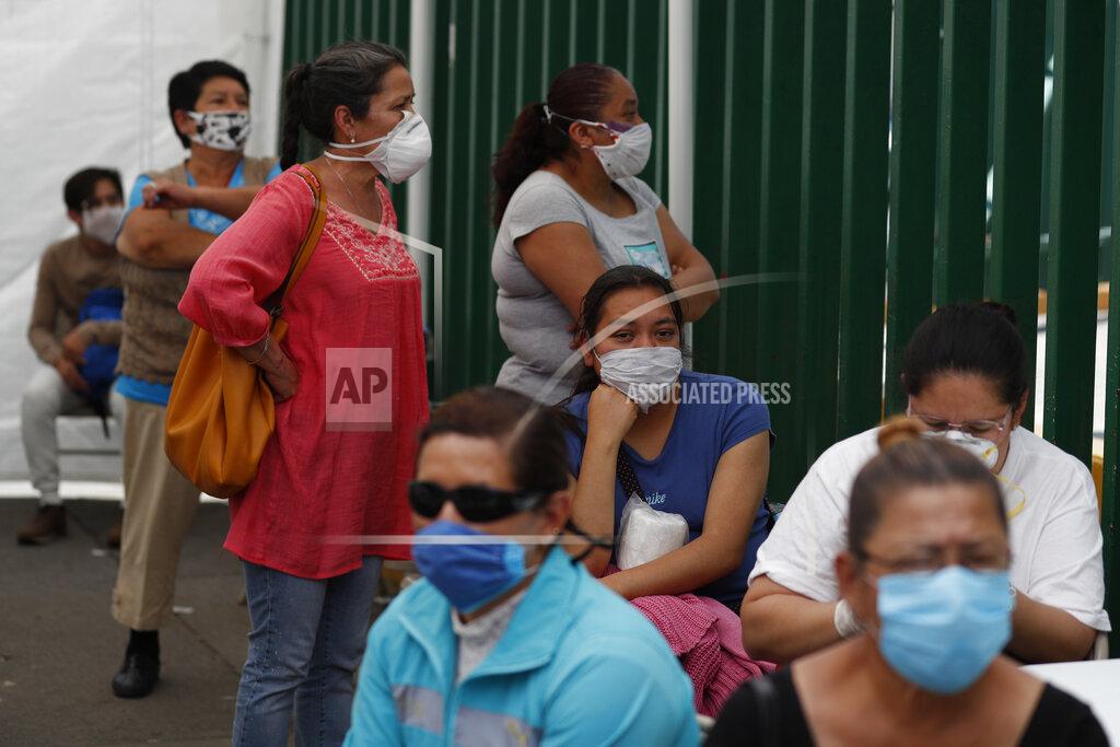 Rebecca Blackwell Family members wait in hopes of receiving news of their hospitalized loved ones, in a tent outside a public hospital treating both COVID-19 and other patients, in the Iztapalapa district of Mexico City, Tuesday, May 5, 2020. Iztapalapa has the most confirmed cases of the new coronavirus within Mexico's densely populated capital, itself one of the hardest hit areas of the country with thousands of confirmed cases and around 500 deaths.(AP Photo/Rebecca Blackwell)