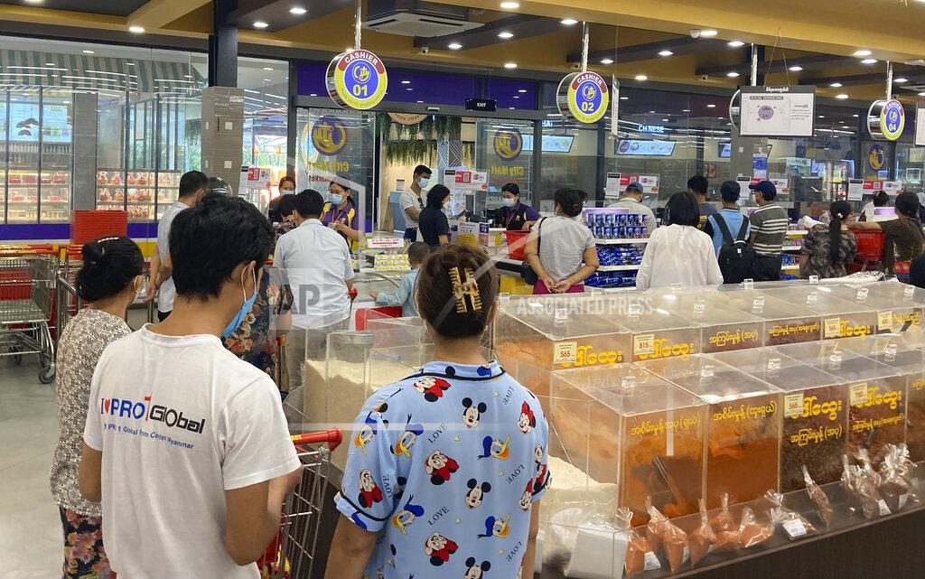 Uncredited People buy food and other grocery items at a supermarket Tuesday, Sept. 7, 2021, in Yangon, Myanmar. The main underground group coordinating resistance to Myanmar's military government called for a nationwide uprising on Tuesday, wherein they also advised people to heed their personal safety and not travel unnecessarily, as well as to stock up on food and medicine, guidance it has offered on at least one past occasion when it warned of trouble ahead. (AP Photo)