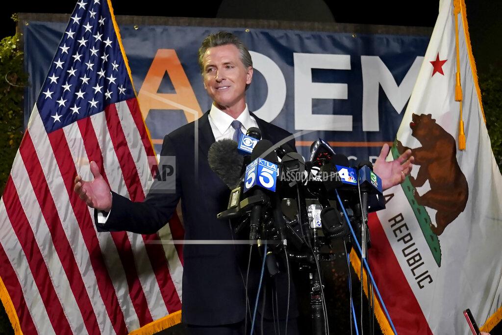 Rich Pedroncelli California Gov. Gavin Newsom addresses reporters after beating back the recall attempt that aimed to remove him from office, at the John L. Burton California Democratic Party headquarters in Sacramento, Calif., Tuesday, Sept. 14, 2021. (AP Photo/Rich Pedroncelli)