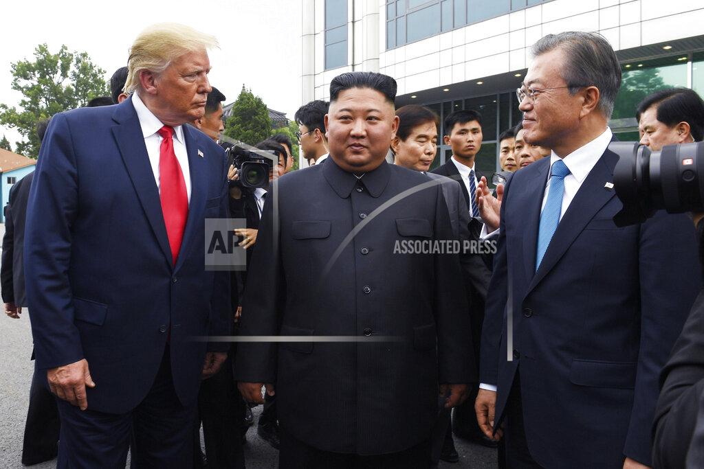 Susan Walsh FILE - In this June 30, 2019, file photo, President Donald Trump, left, meets with North Korean leader Kim Jong Un and South Korean President Moon Jae-in, right, at the border village of Panmunjom in the Demilitarized Zone, South Korea. For both North and South Korea, the fate of nuclear negotiations is top of mind as the two countries look at the U.S. election. (AP Photo/Susan Walsh, File)