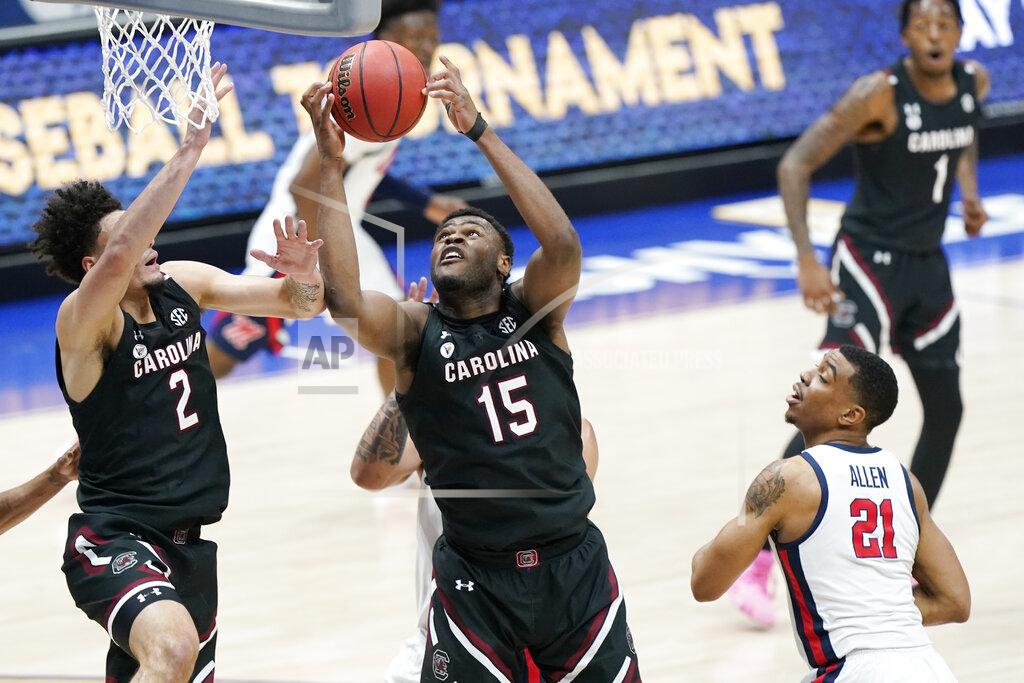 Mark Humphrey South Carolina's Wildens Leveque (15) grabs a rebound in front of Mississippi's Robert Allen (21) in the first half of an NCAA college basketball game in the Southeastern Conference Tournament Thursday, March 11, 2021, in Nashville, Tenn. (AP Photo/Mark Humphrey)
