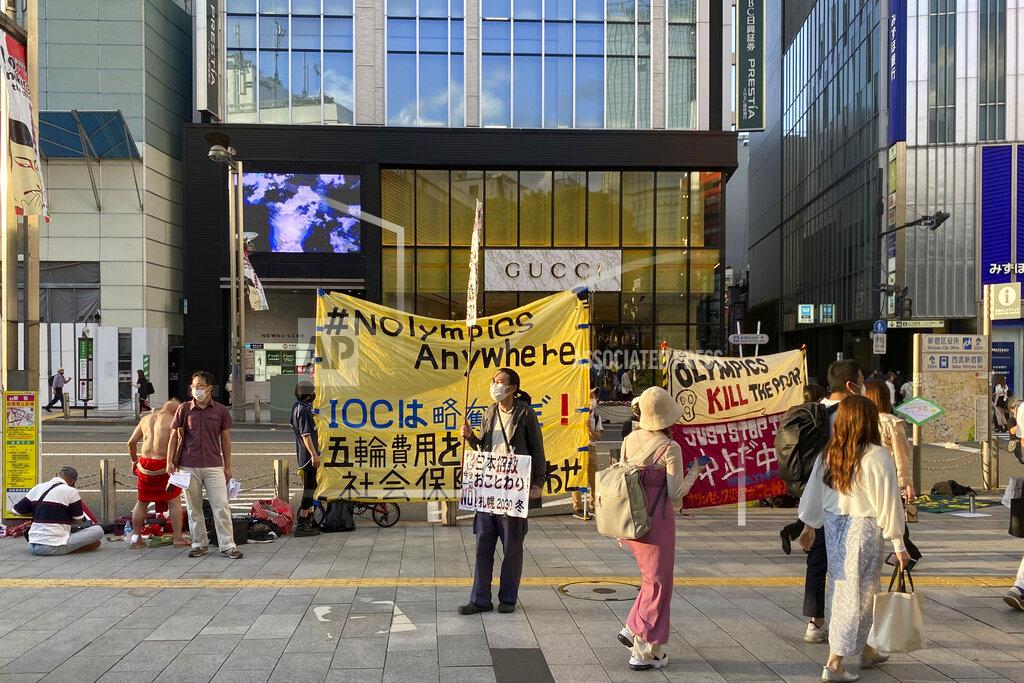 Yuri Kageyama Protesters stage a rally against Japan's Sapporo 2030 Olympics bid, in Shinjuku district of Tokyo, Japan, Sunday, June 12, 2022. Holding “No Olympics” banners, protesters demanded Japan drop its bid for the 2030 Winter Games Sunday.(AP Photo/Yuri Kageyama)