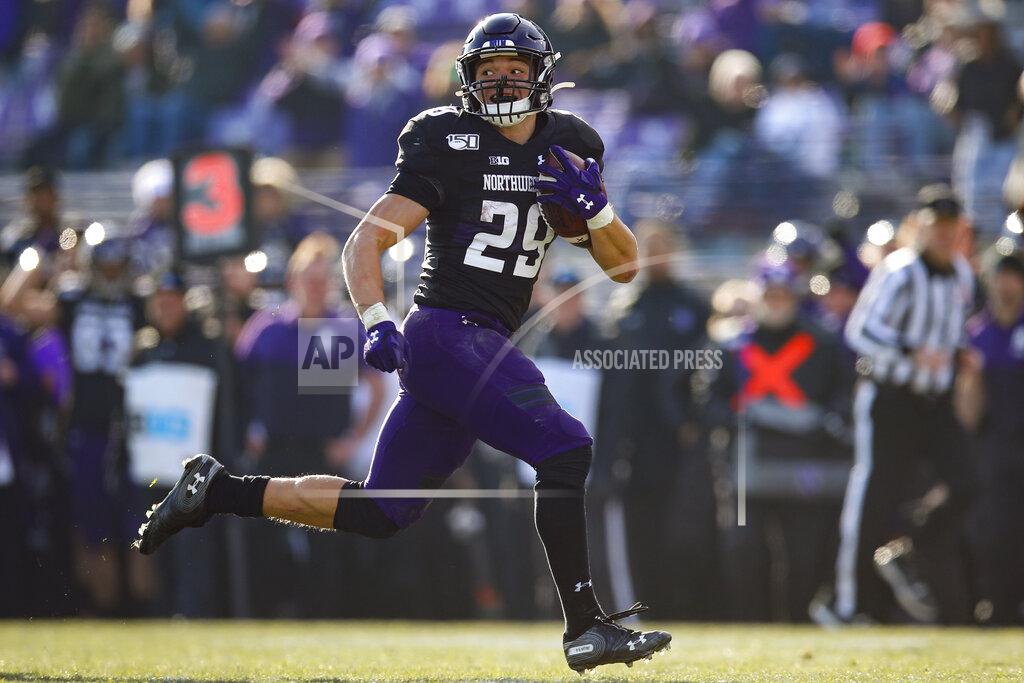 Northwestern's Evan Hull runs to score a touchdown against Massachusetts during the second half of an NCAA college football game Saturday, Nov. 16, 2019, in Evanston, Ill. (AP Photo/Jim Young)