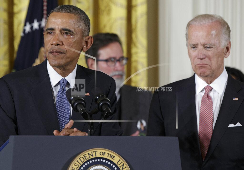 Carolyn Kaster FILE - Vice President Joe Biden looks on as tears flow down President Barack Obama's face as he speaks in the East Room of the White House in Washington, Tuesday, Jan. 5, 2016, about steps his administration is taking to reduce gun violence. (AP Photo/Carolyn Kaster, File)