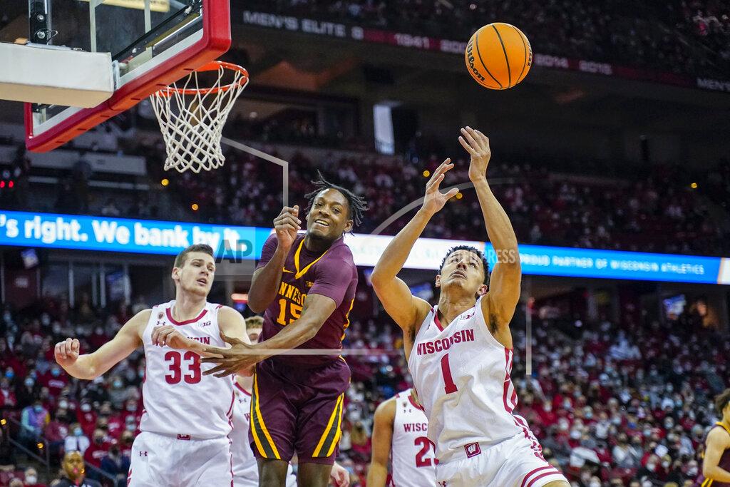 Andy Manis Wisconsin's Johnny Davis (1) grabs a defensive rebound against Minnesota's Charlie Daniels (15) during the first half of an NCAA college basketball game Sunday, Jan. 30, 2022, in Madison, Wis. (AP Photo/Andy Manis)